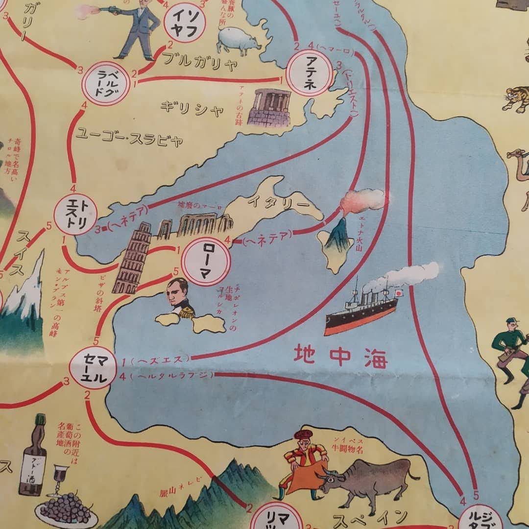 Gros plan sur la zone de la Méditerranée et de l'Europe du Sud, montrant l'Italie (Tour de Pise, Rome) et l'Espagne (Toréador) avec les indications numérotées du parcours.