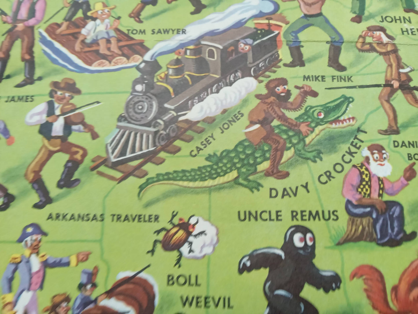 Carte picturale dépliante, vintage des contes et légendes américains, intitulée 'American Folklore & Legends', créée par John Dukes McKee vers 1950, illustrant une multitude de figures historiques, folkloriques et mythiques à travers les États-Unis