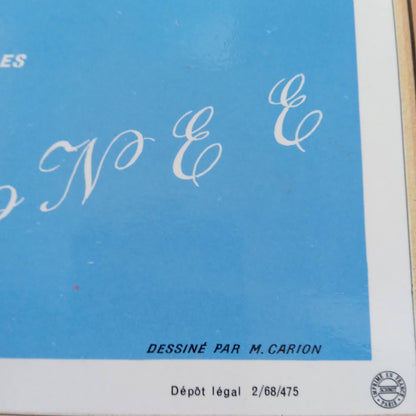 Détail du coin inférieur de la carte indiquant l'auteur "DESSINÉ PAR M. CARION" et le numéro de dépôt légal "2/68/475".
