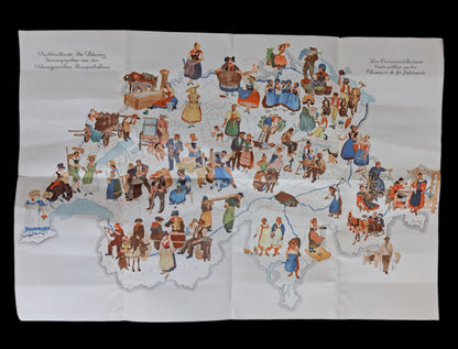 Carte illustrée de la Suisse sur fond blanc, peuplée de dizaines de petits personnages en costumes folkloriques traditionnels. Des titres en allemand et en français figurent dans les coins supérieurs.