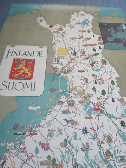 Détail d'un plan touristique rétro de 1949 montrant la Laponie finlandaise, avec des dessins de rennes, de skieurs et la ville de Rovaniemi.